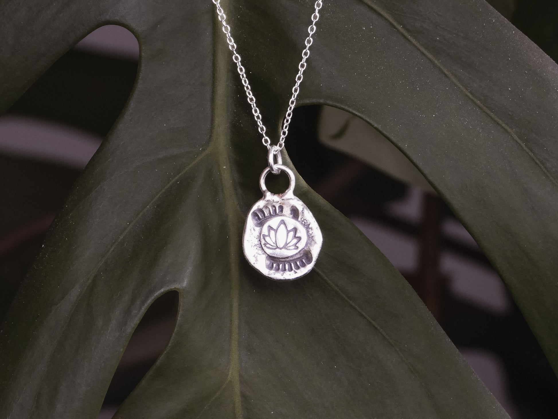 lotus flower symbology necklace made with recycled sterling silver