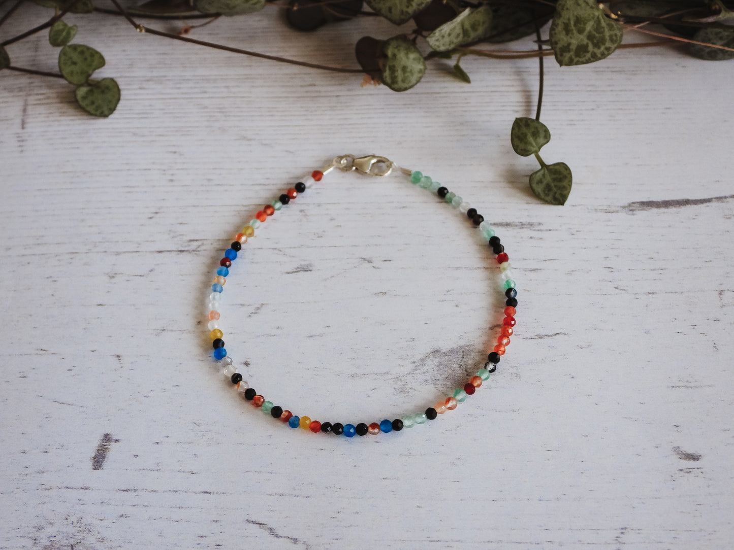 dainty and minimalist crystal healing beaded bracelet with rainbow agate beads